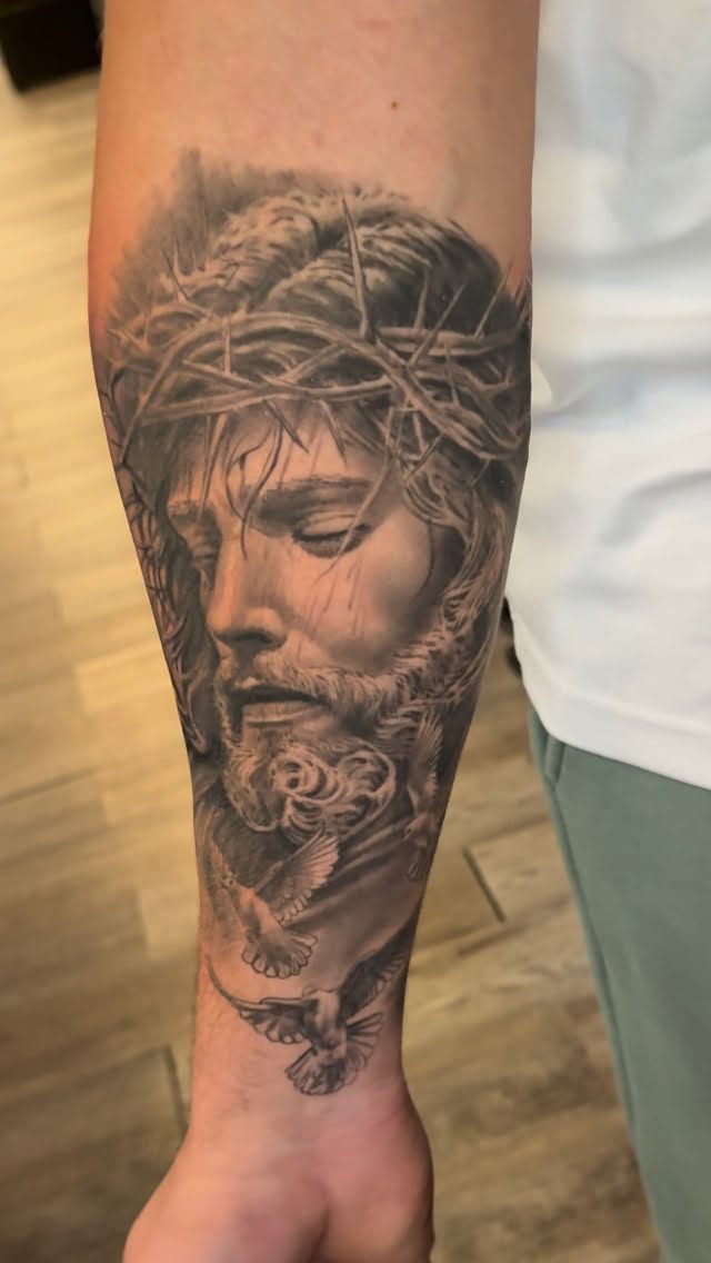 Realistic grayscale Jesus portrait with crown of thorns and dove