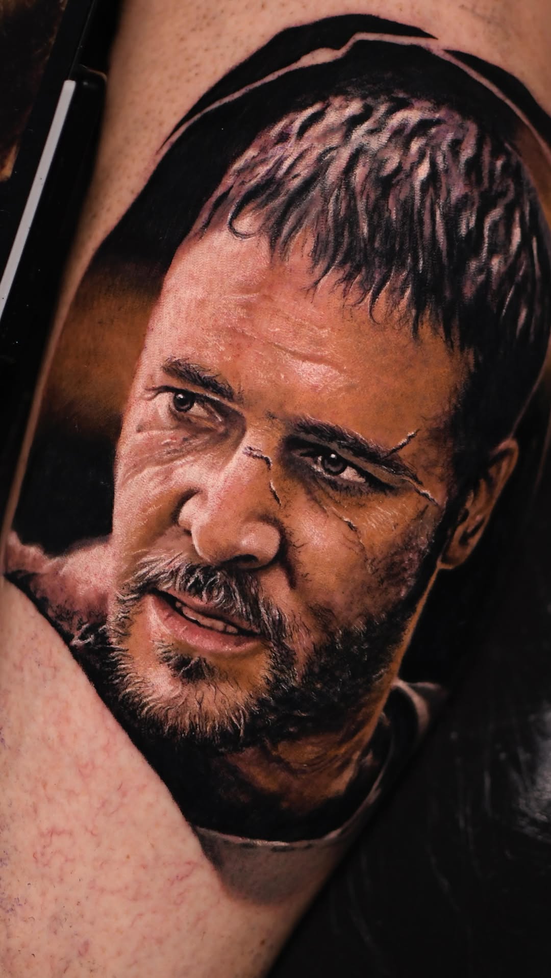 Photorealistic grayscale portrait tattoo, intense gaze, rugged beard