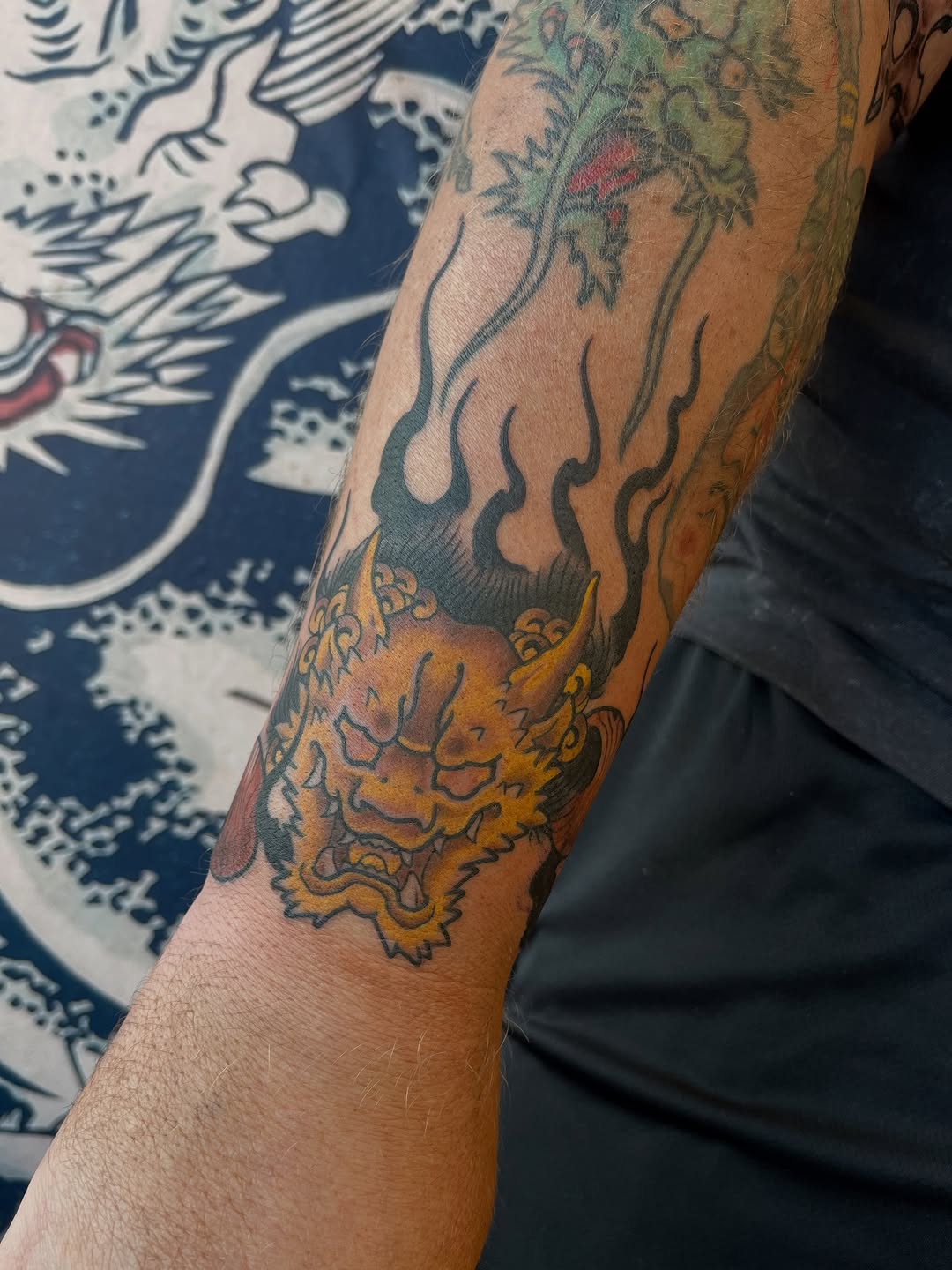 Bold Japanese oni head with fiery flames, neo-traditional.