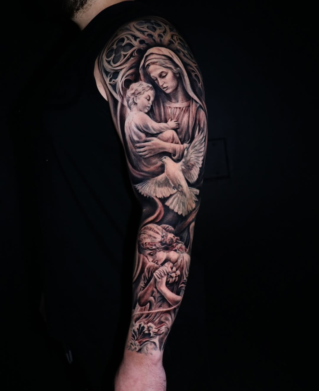 Intricate black-and-gray religious sleeve with Madonna and dove