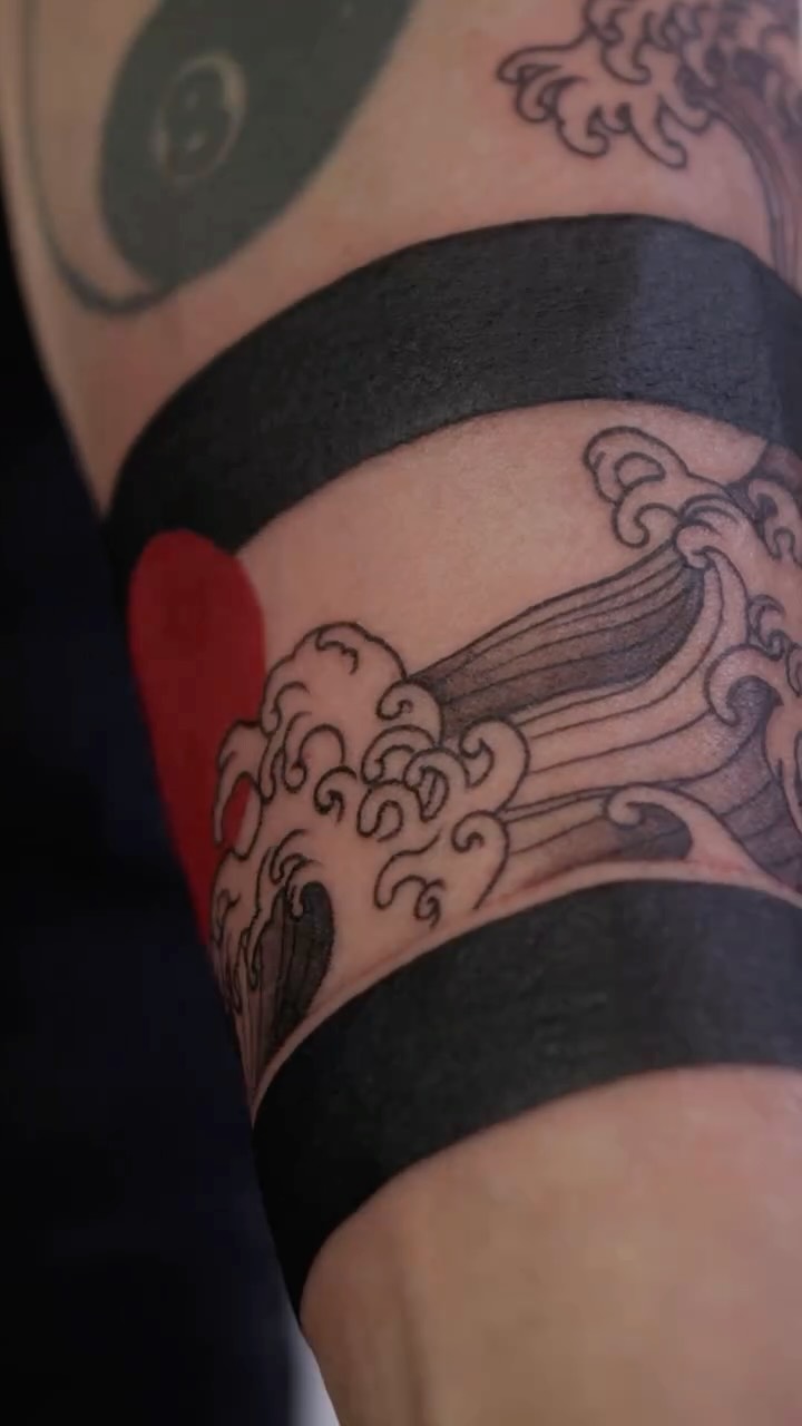 Bold Japanese wave armband with sun accent and clouds