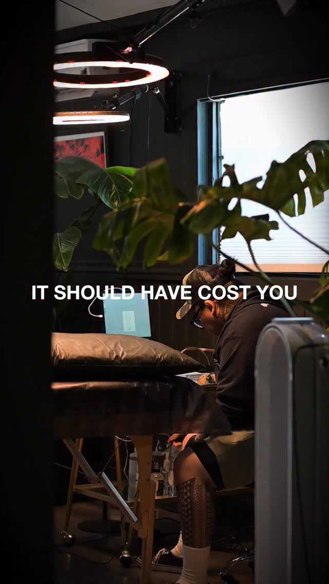 Bold geometric leg piece with intricate blackwork lines.