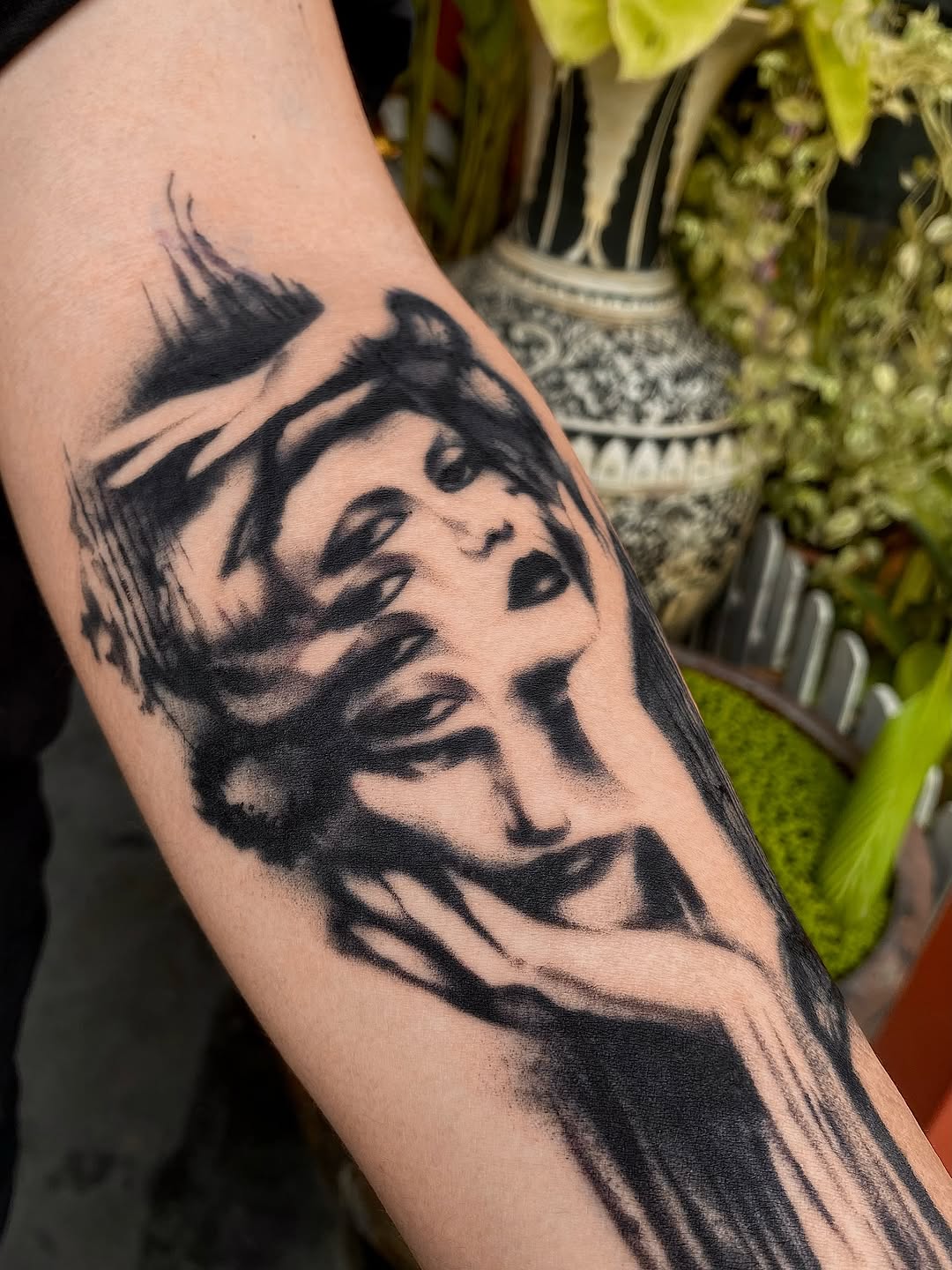 Bold blackwork multi-face portrait with brushstroke shading