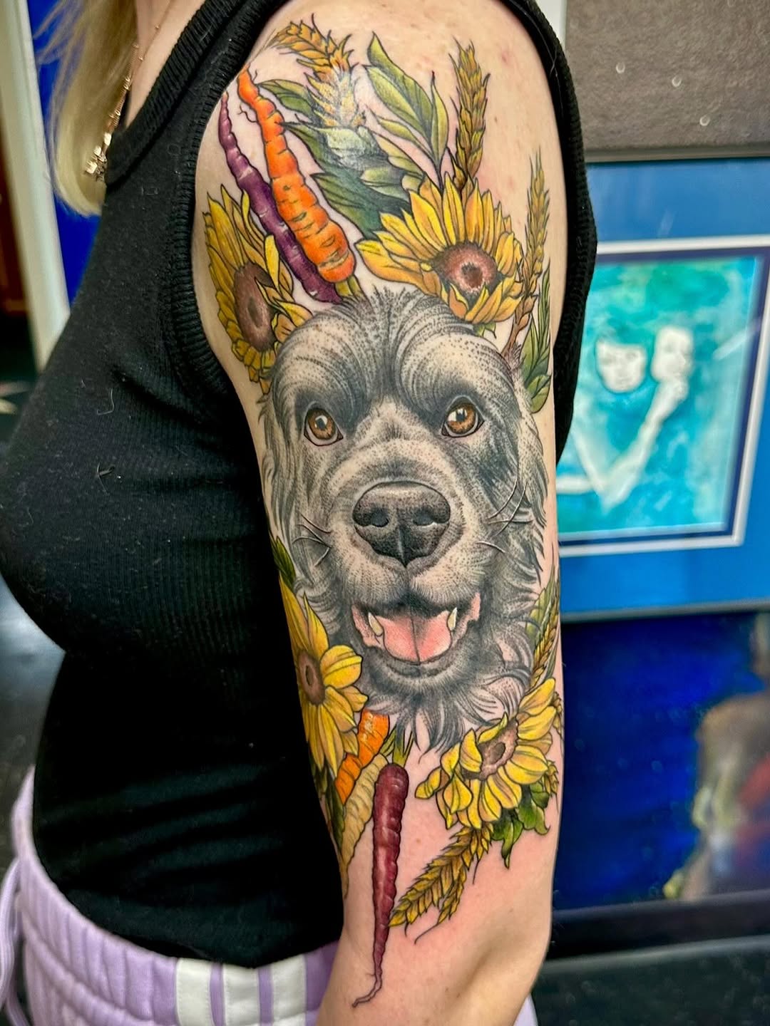Colorful dog tattoo with flowers