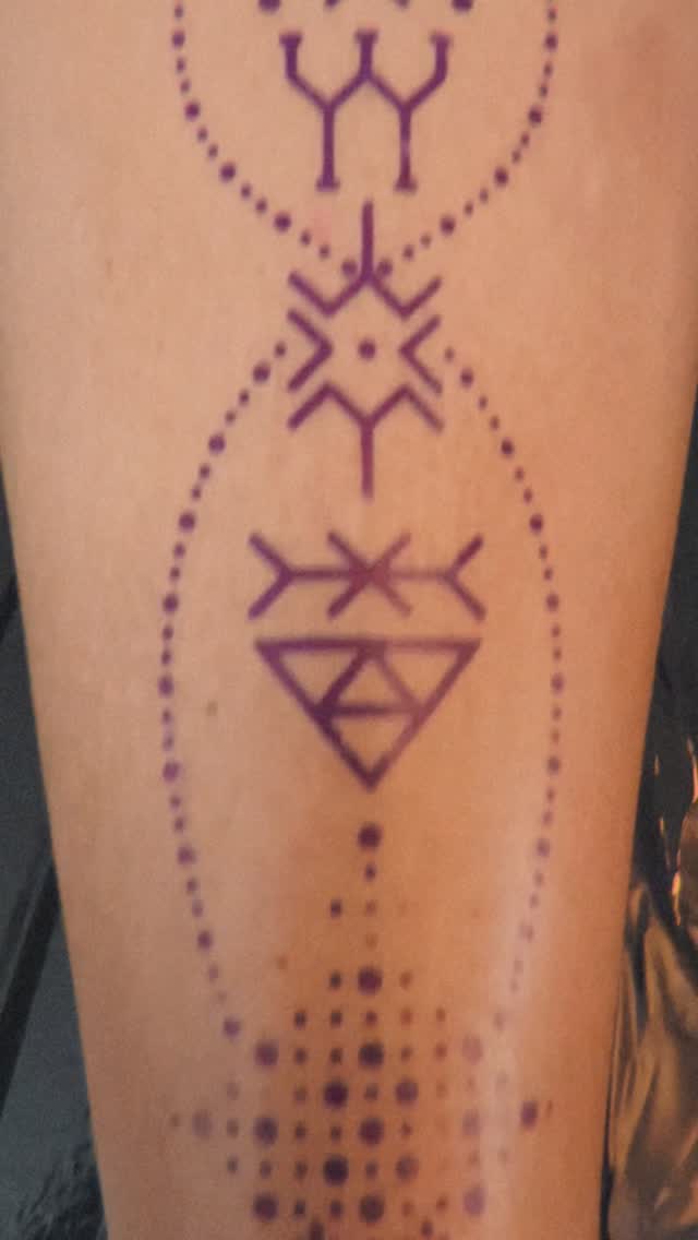 Minimalist geometric ornament with dotted halos and triangles