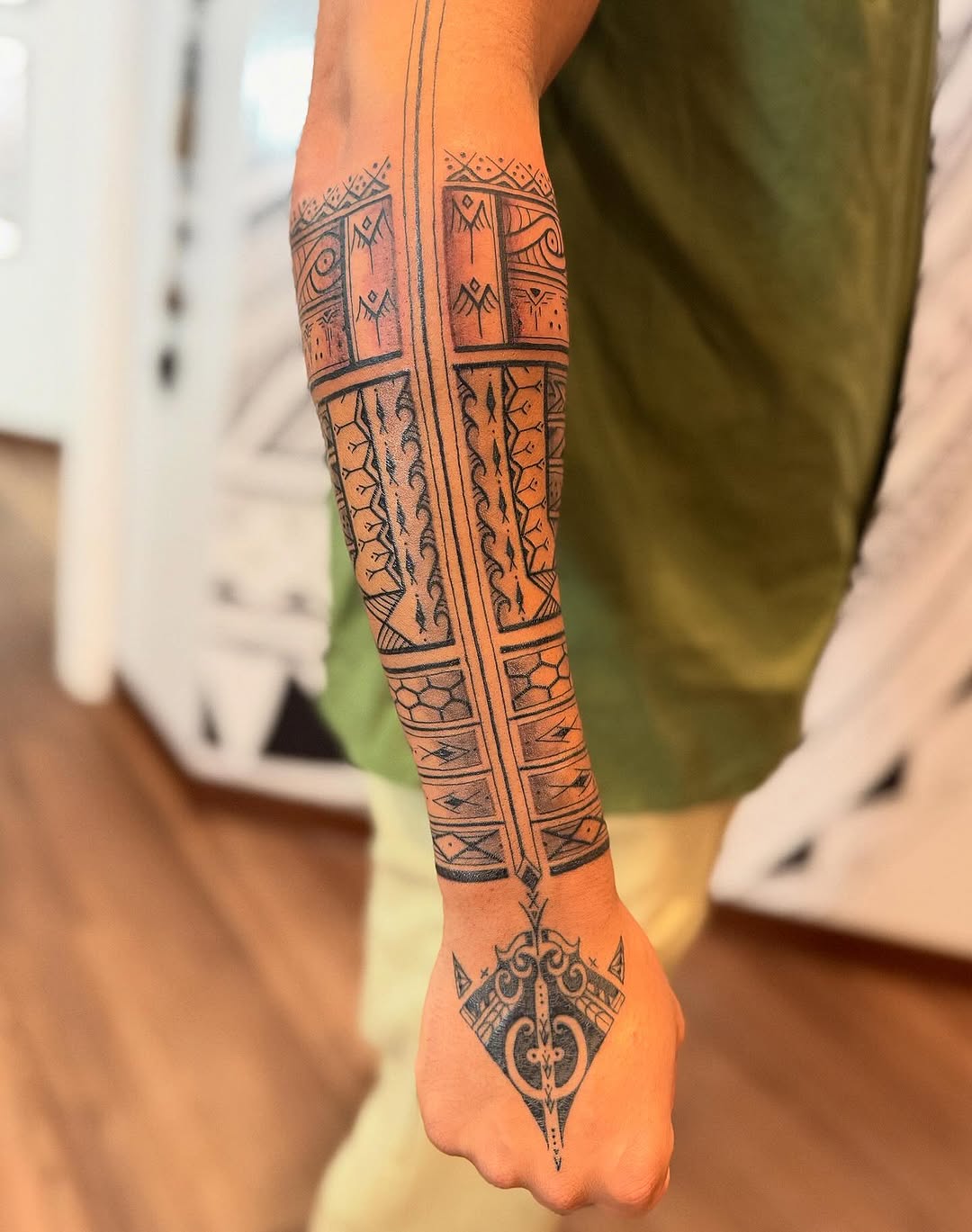 Bold Polynesian tribal sleeve with geometric banding and detail