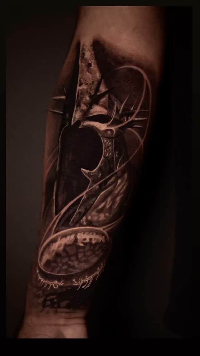 Intricate blackwork forearm piece with celestial circles and lines