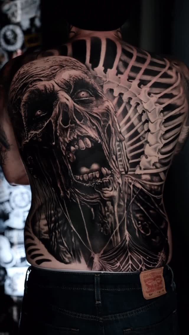 Monstrous full-back zombie portrait with ribcage skeletal details