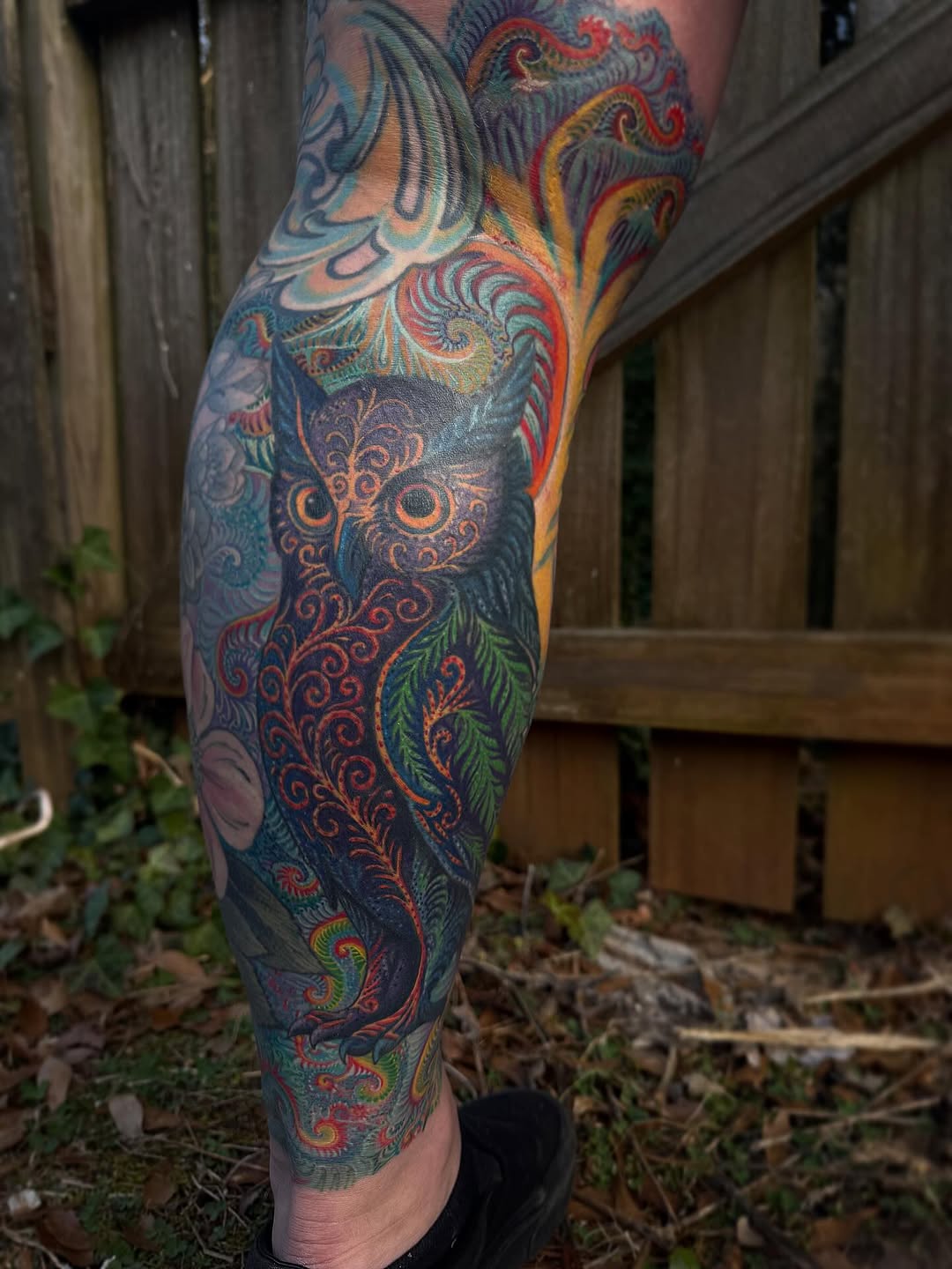 Colorful leg sleeve with ornate owl motif and arabesque scrolls