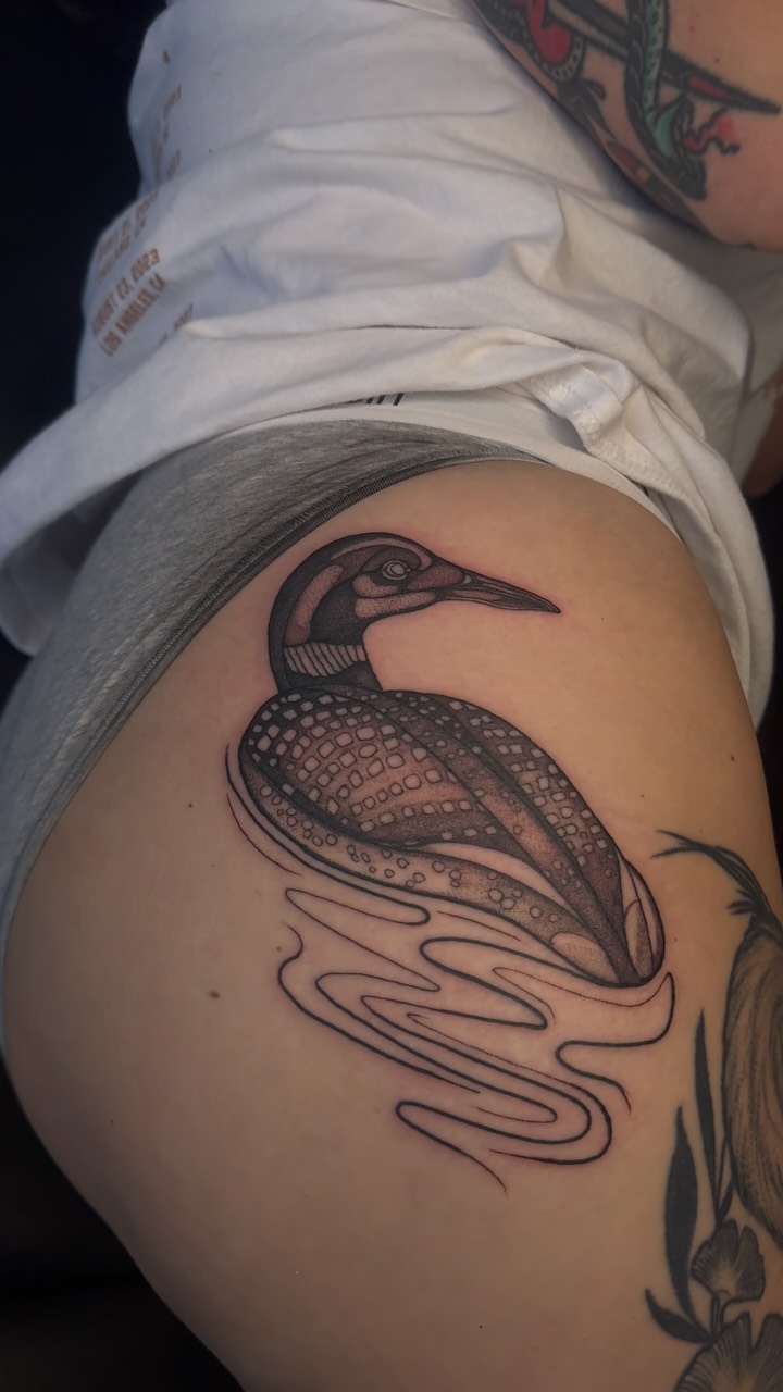 Bold blackwork waterbird with dot shading and flowing waves
