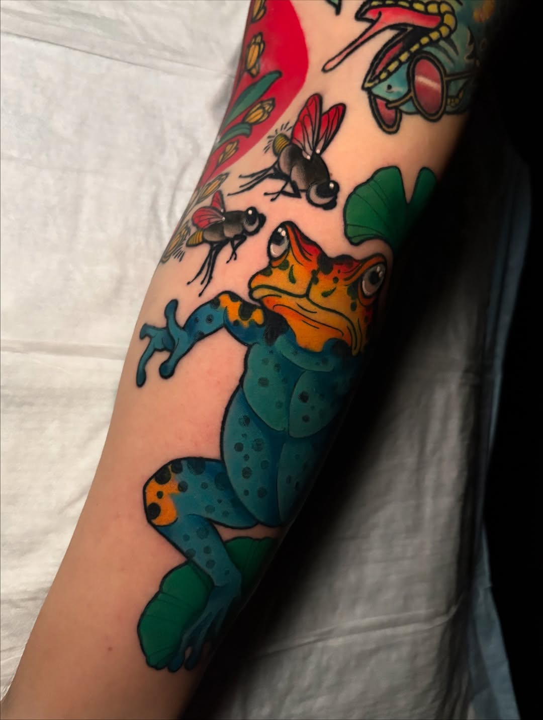 Playful neon frog battles tiny flies in bold lines