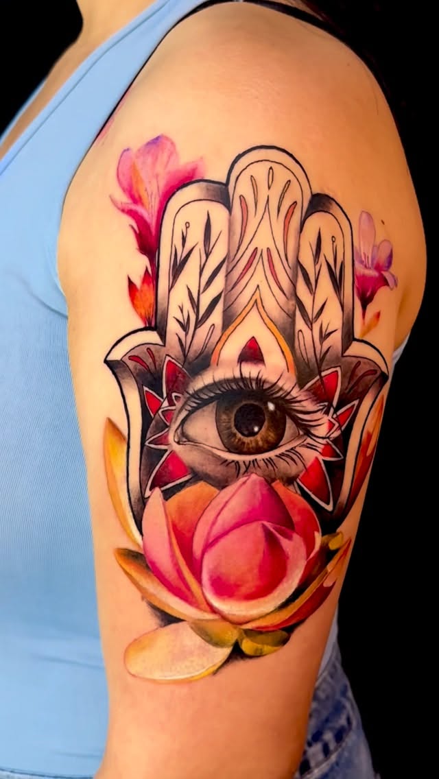 Vibrant hamsa hand with central eye and florals
