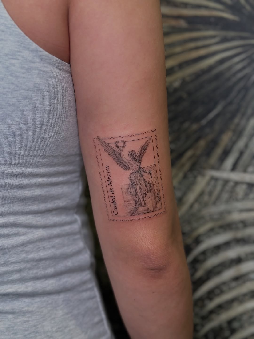 Stamp-style winged-angel in vintage postage frame