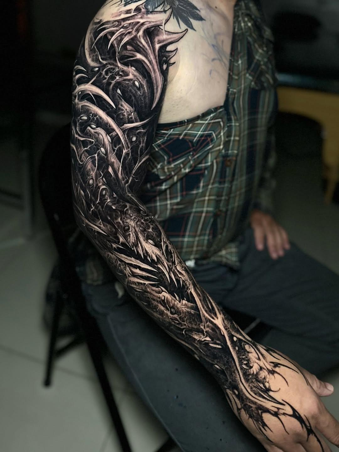 Bold blackwork full-sleeve with jagged organic textures