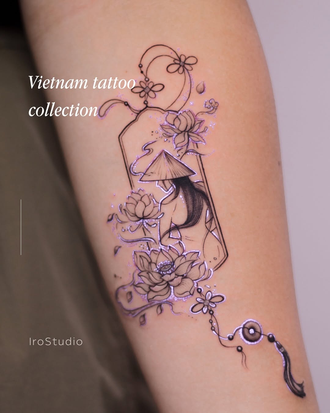 Delicate lotus blossoms flow around a hanging frame portrait.