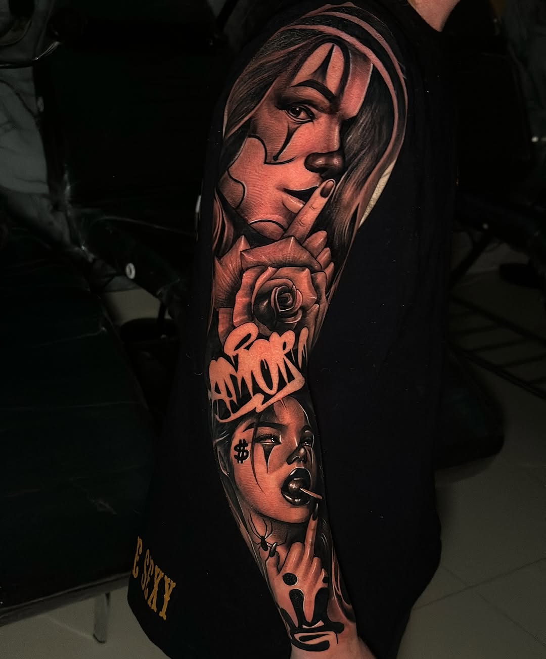 Striking black-and-gray sleeve with female portrait, rose