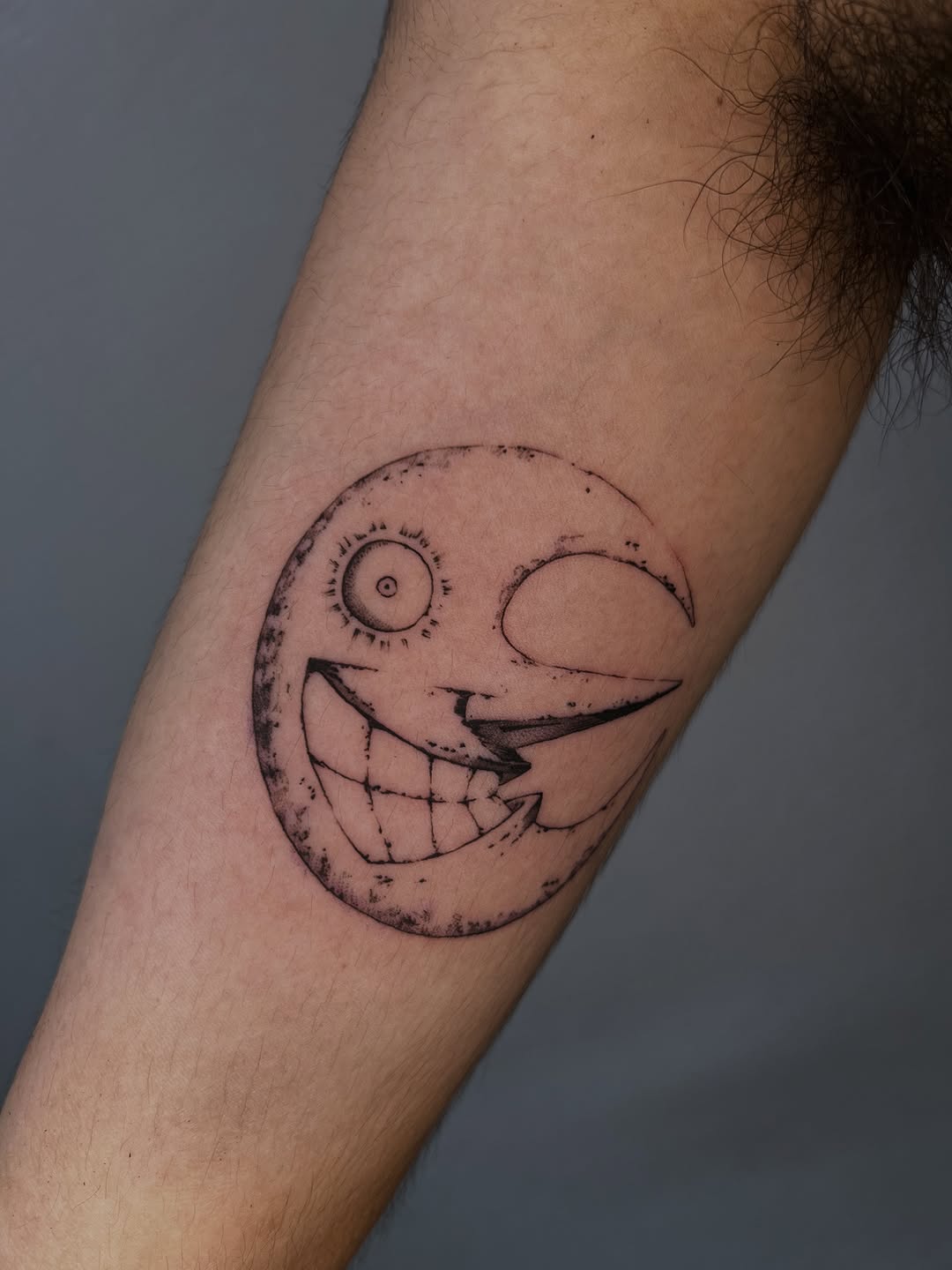 Whimsical crescent moon with a toothy grin.