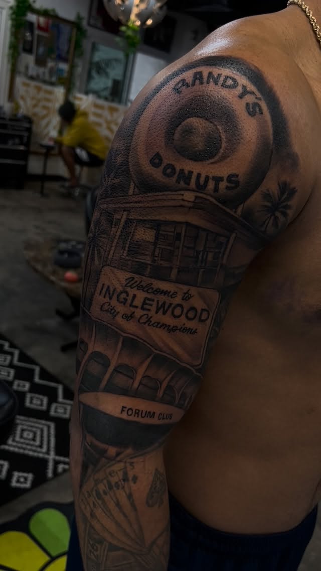 Monumental black-and-gray sleeve of Inglewood signs and donuts