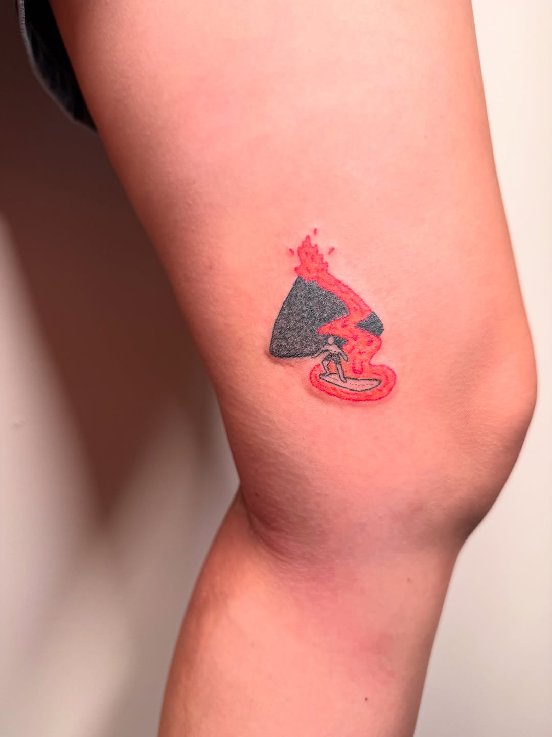 Lava wave surfing tattoo