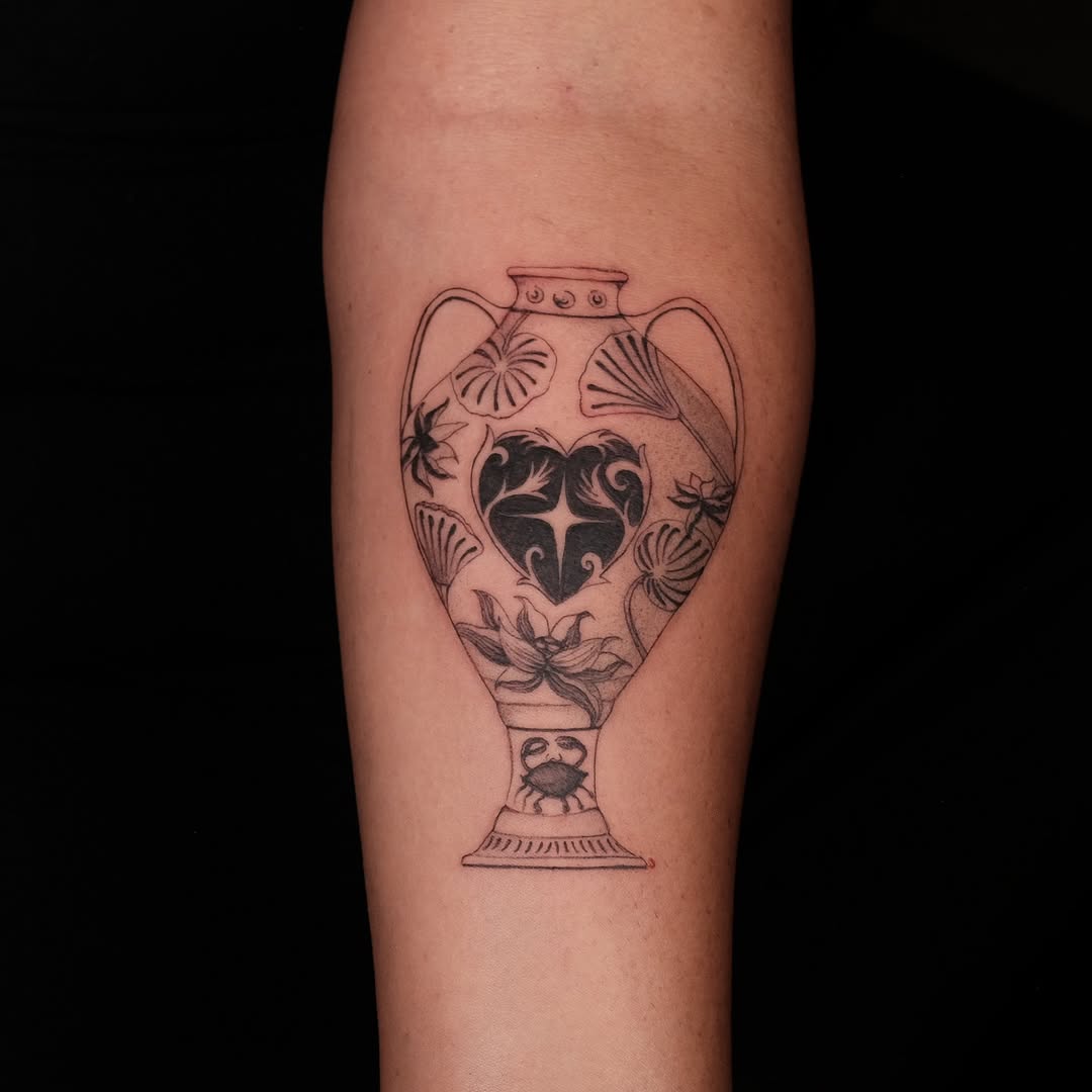 Ornate vase silhouette adorned with blooms and heart centerpiece