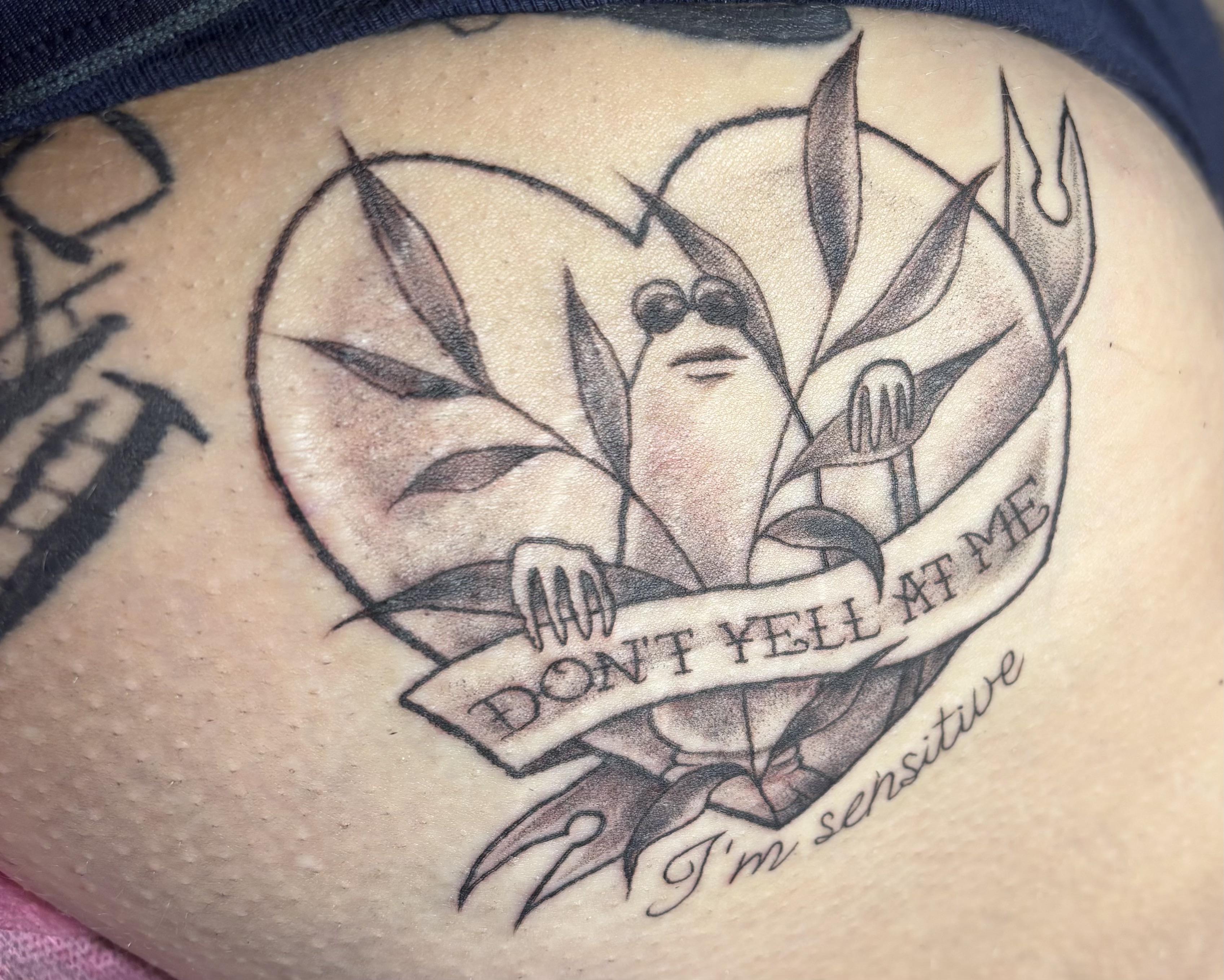 Whimsical cartoon figure holds banner reading 'Don't yell at me'.