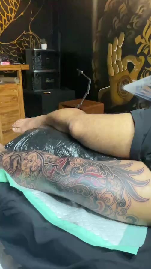 Japanese-inspired dragon sleeve with swirling clouds and waves