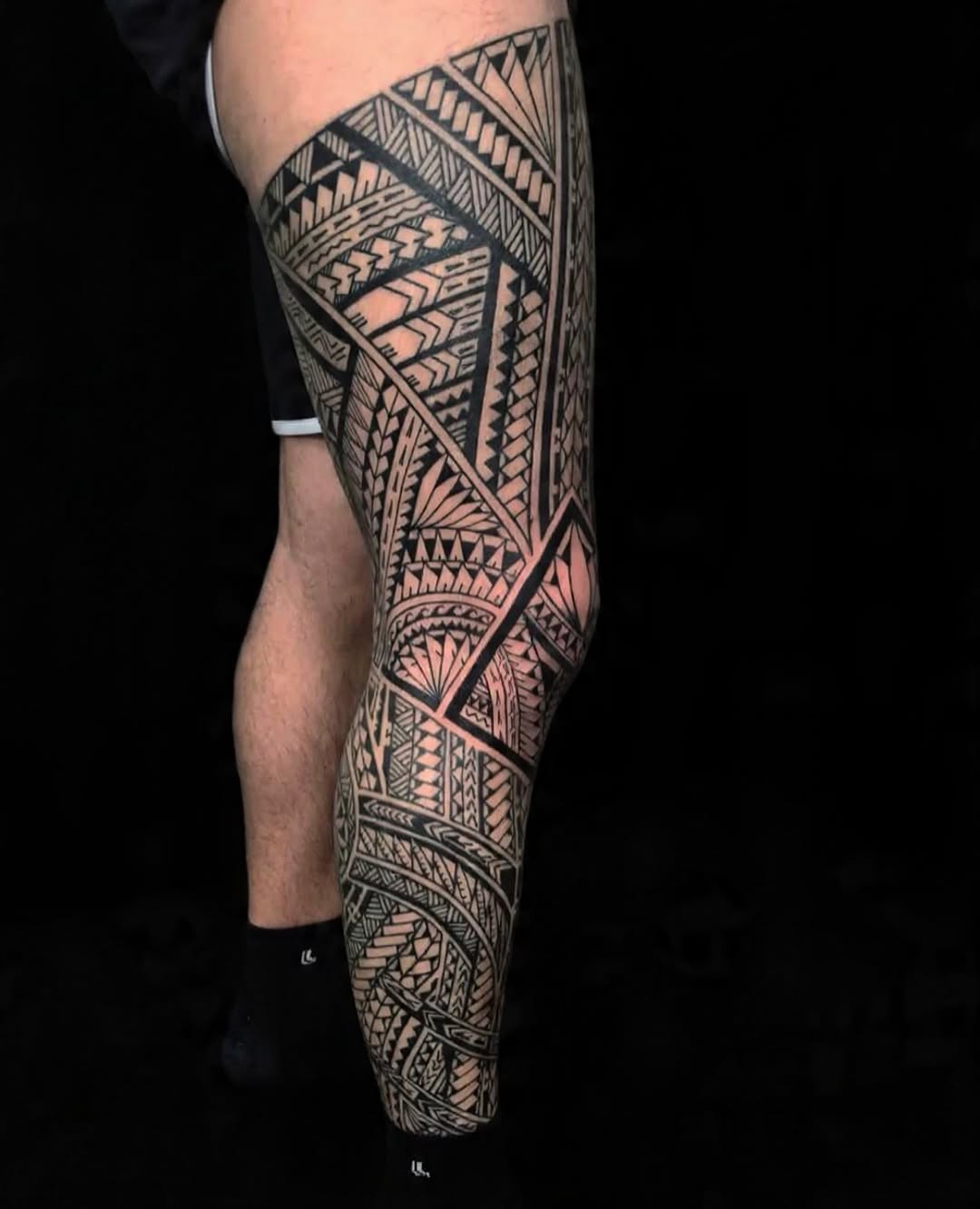 Exquisite Polynesian tribal leg sleeve in bold blackwork