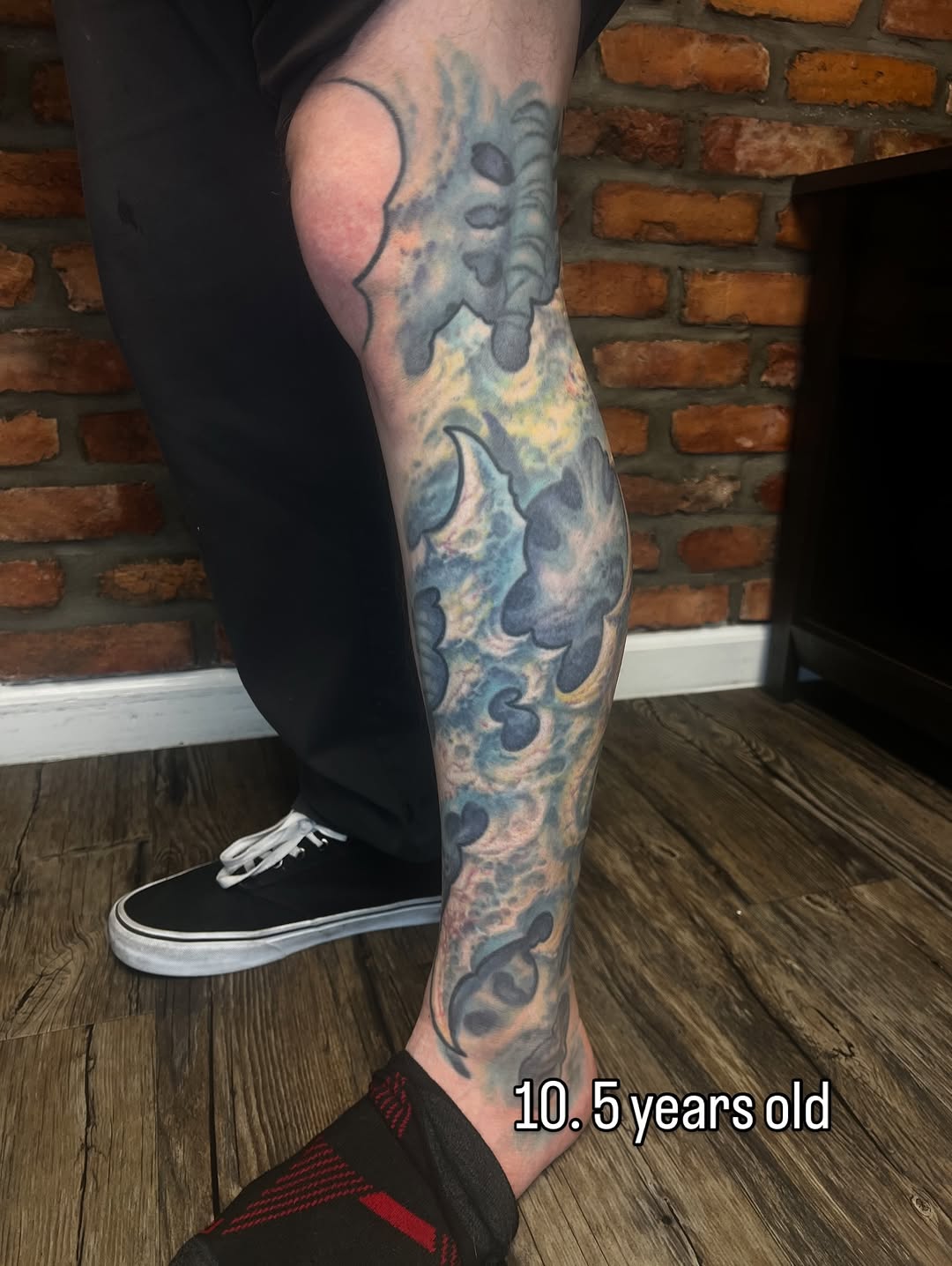 Bio-organic sleeve with blue watercolor fog and dark outlines.