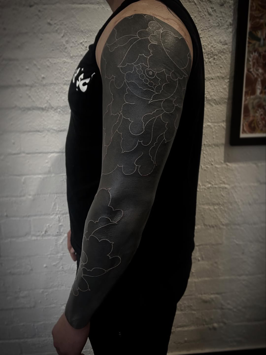 White-line floral sleeve with peony-inspired outlines