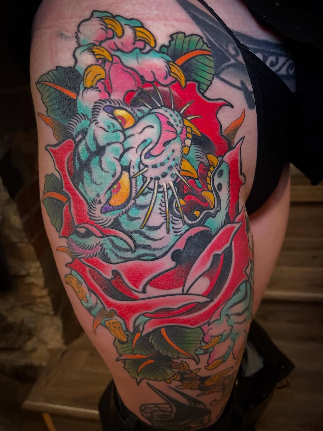 Bold neo-traditional dragon head with vibrant florals