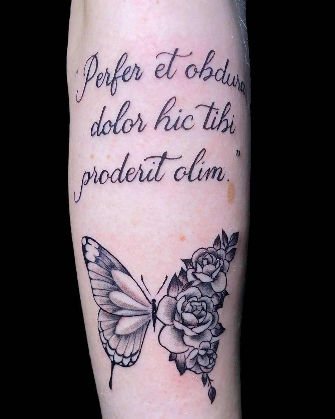 Elegant cursive script with butterfly and roses.