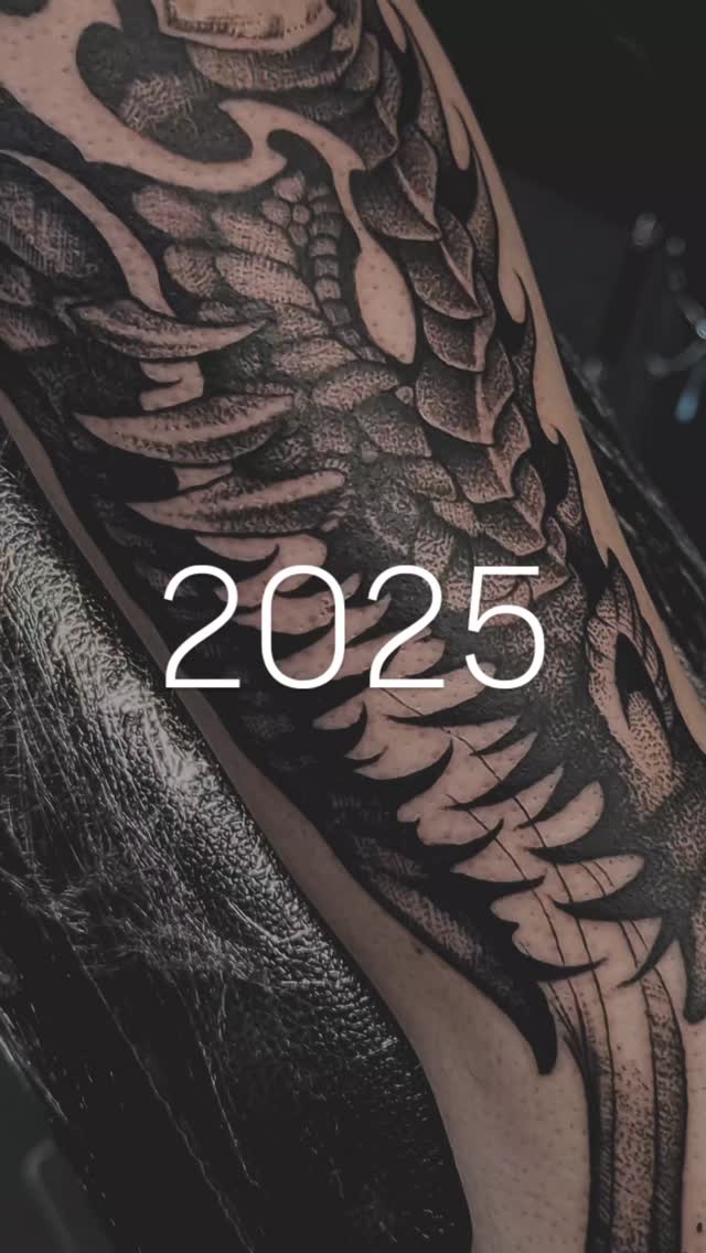 Dramatic blackwork feathered scales wrap leg in bold