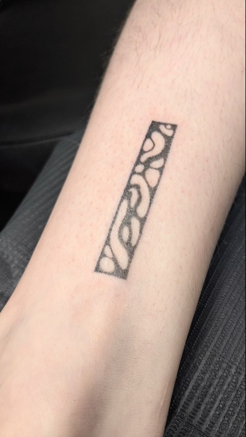 Rectangular blackwork with organic blob shapes, minimalist.