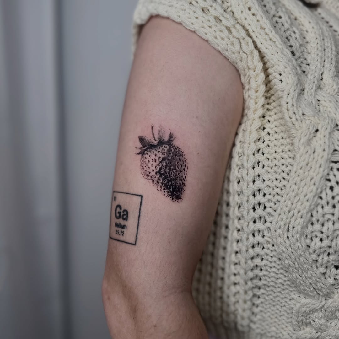 Hyper-detailed black-and-gray strawberry with Ga tile.