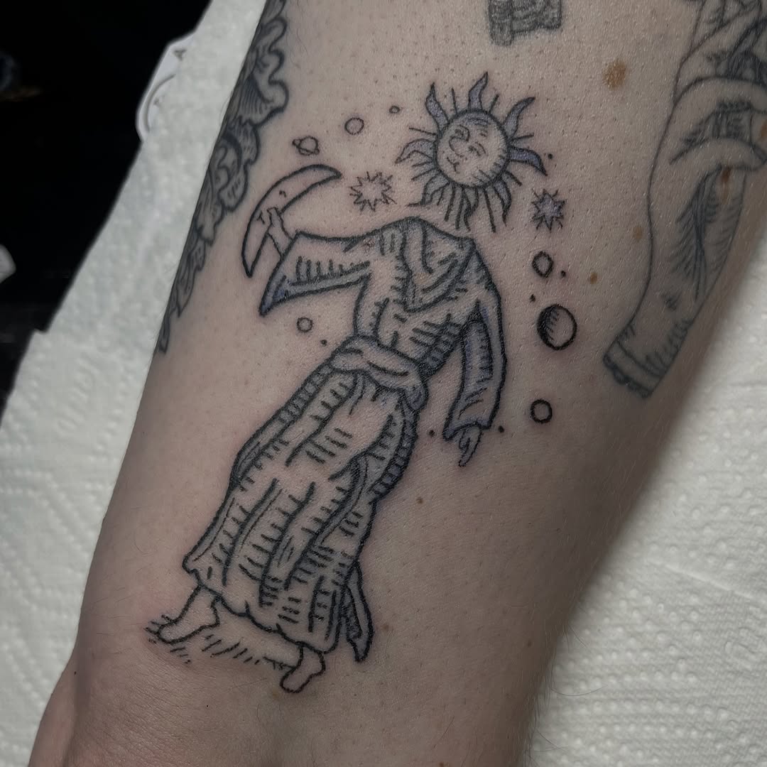 Sun-faced wanderer in robe, wielding a scythe.