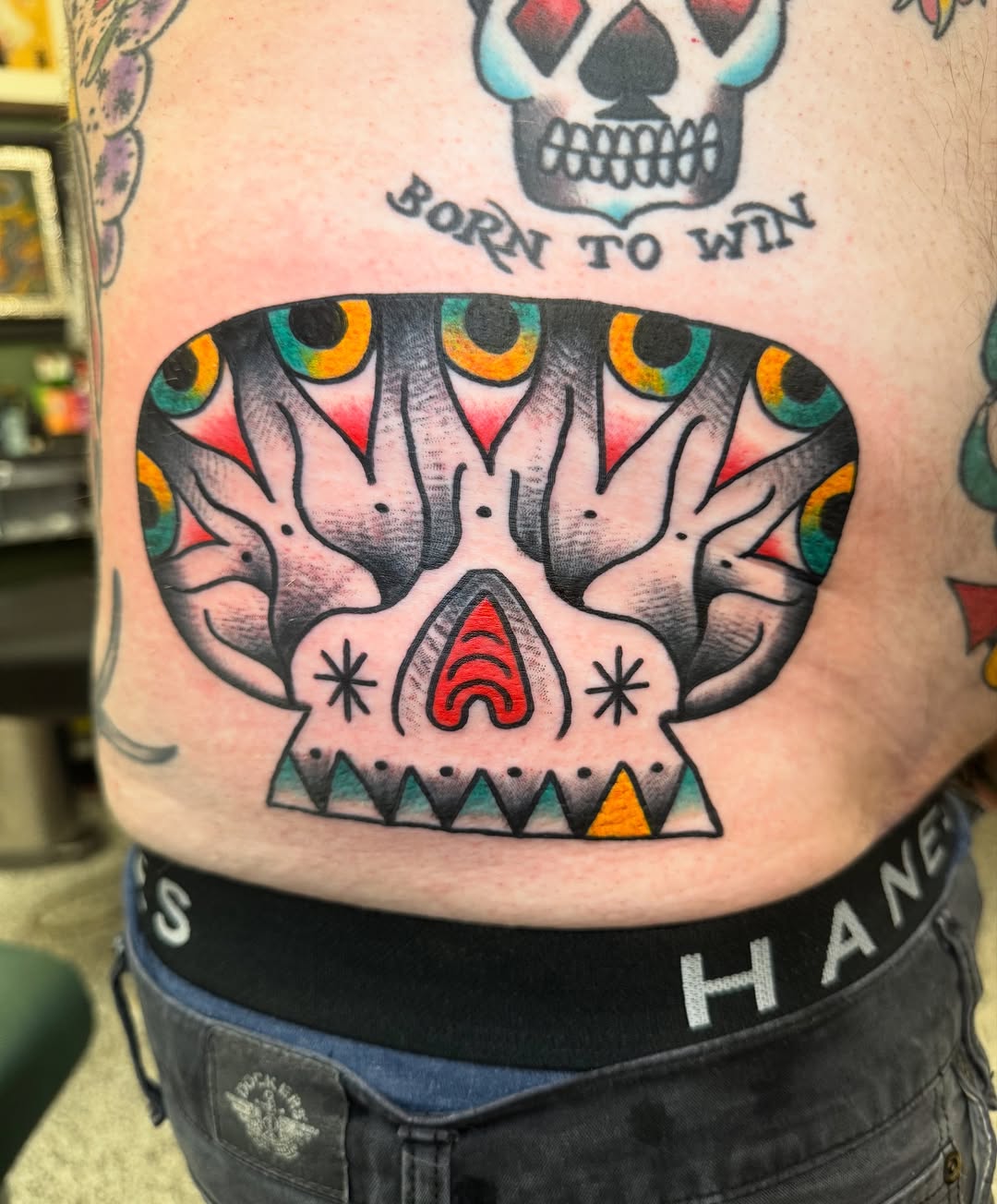 Vibrant sugar-skull inspired back piece with bold outlines