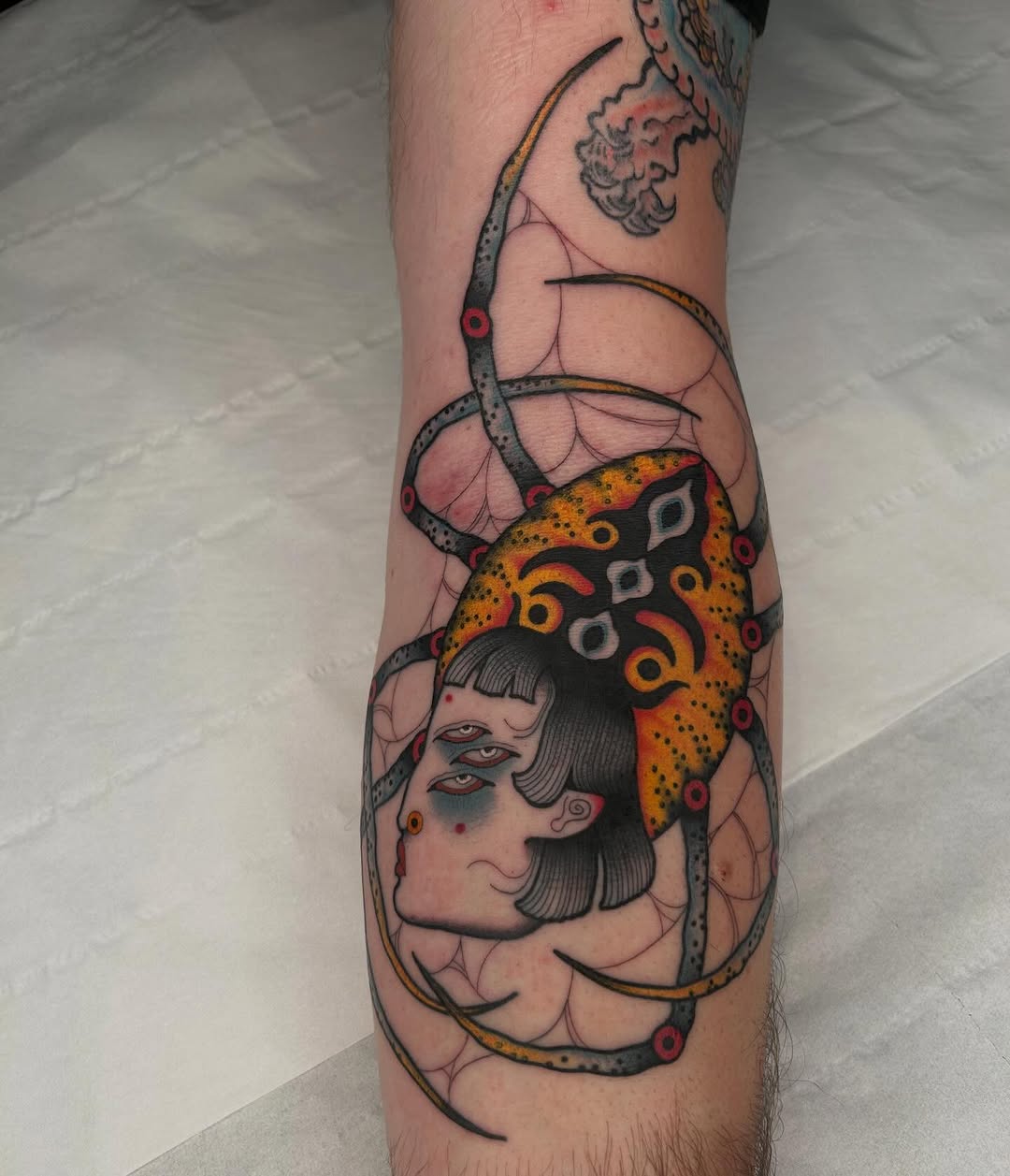 Vivid neo-traditional female portrait wrapped in a spiderweb mandala