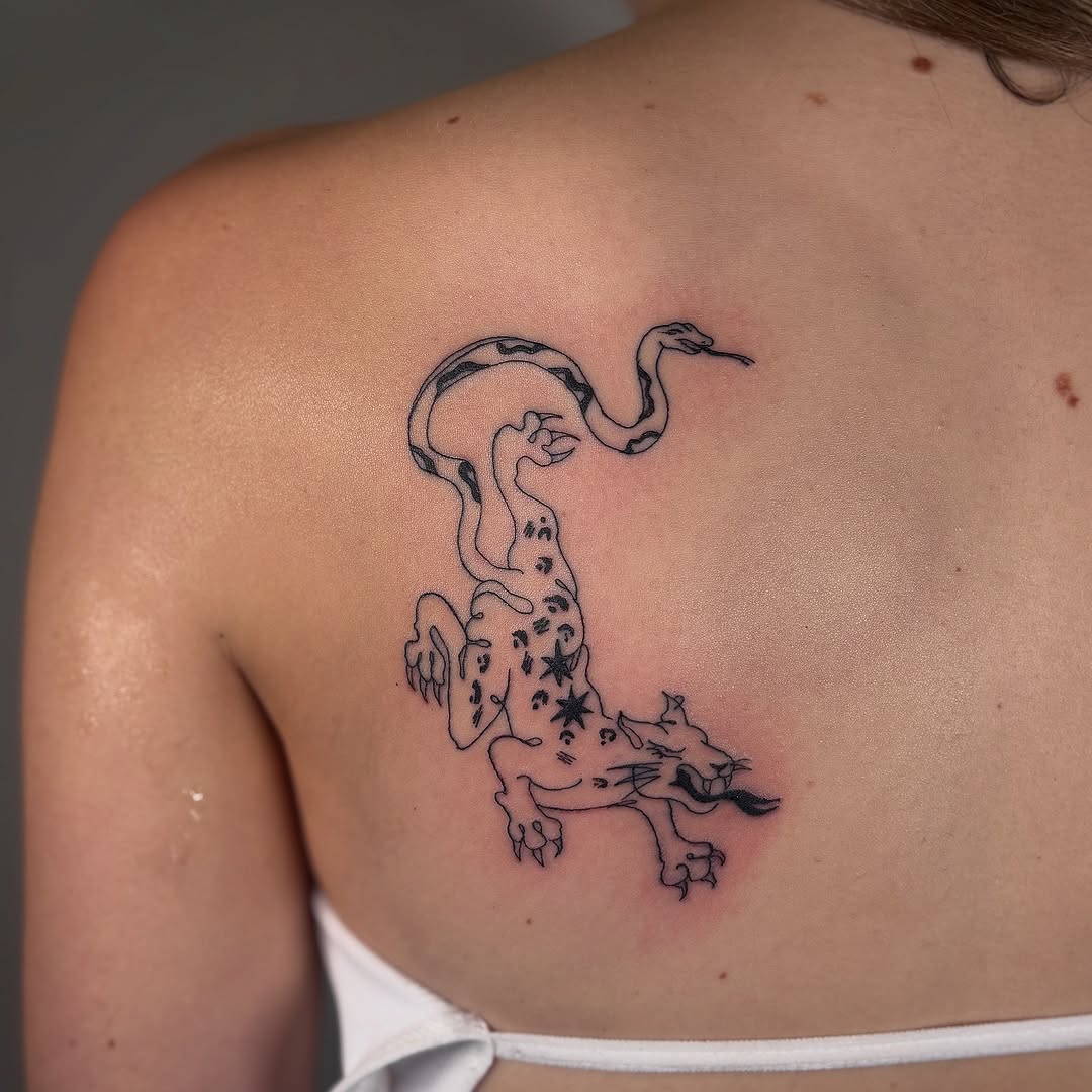 Minimalist cheetah snake tattoo