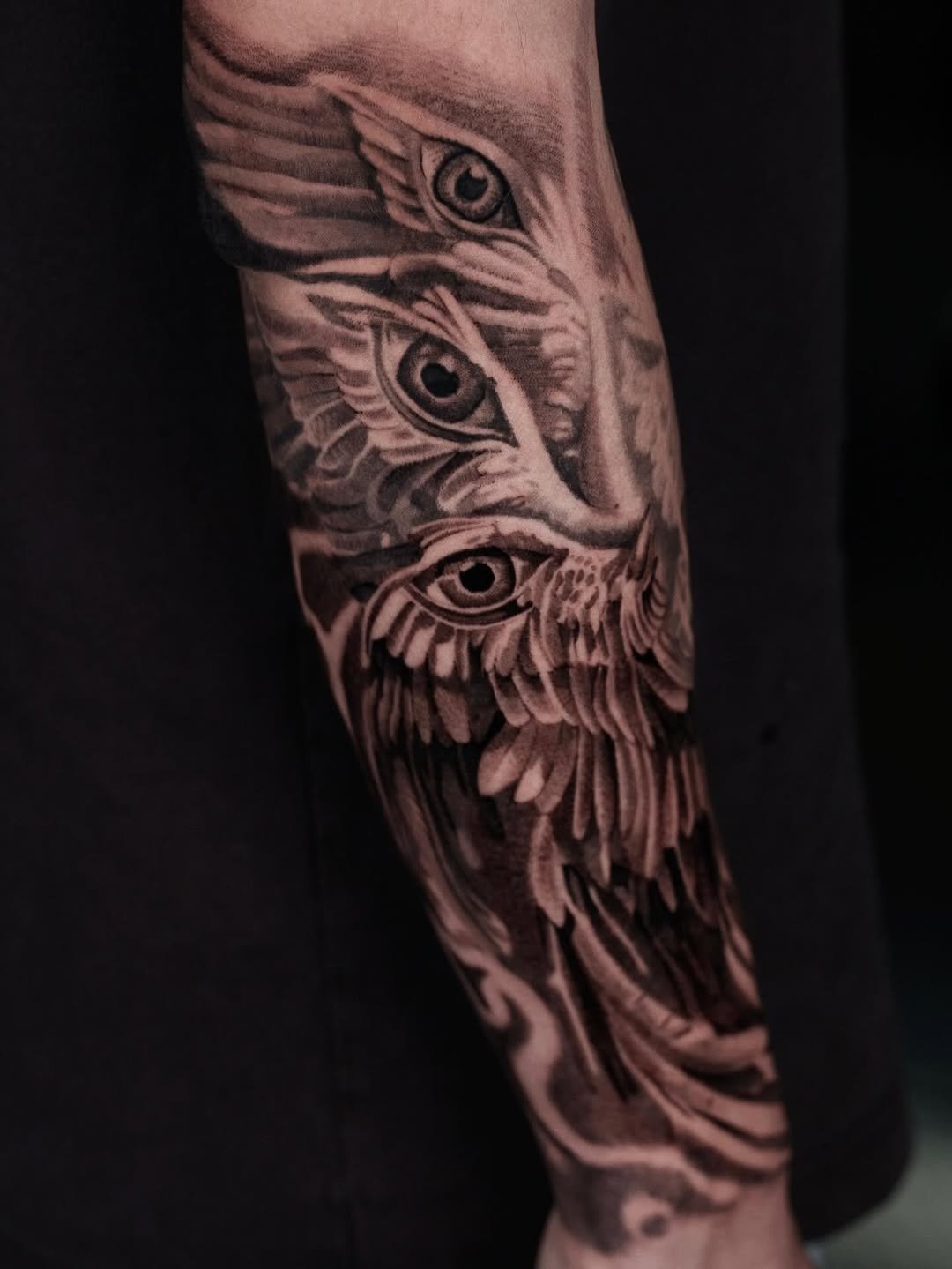 Seraphim-inspired winged-eye sleeve in bold grayscale