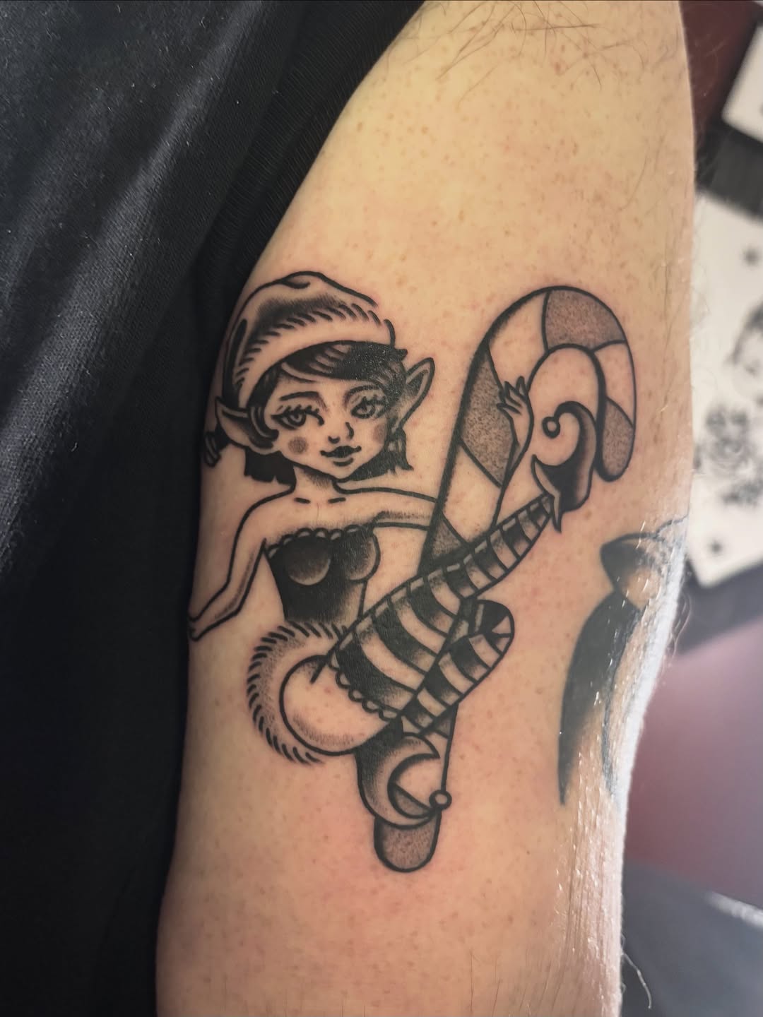 Playful elf-like girl with bold, curling striped tail