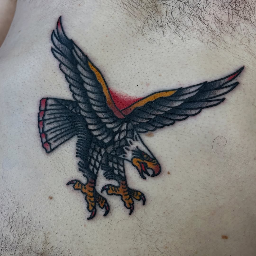 Bold neo-traditional eagle in flight, dark shading with orange talons