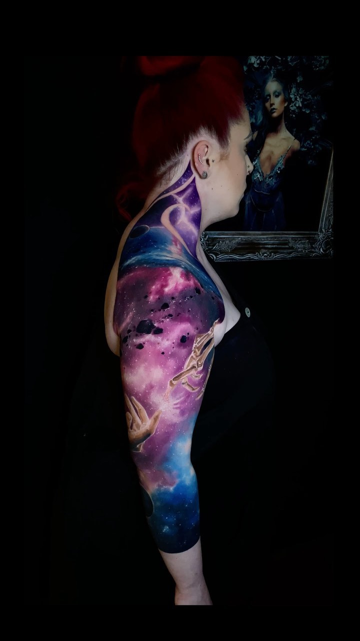 Vibrant galaxy nebula sleeve with reaching cosmic hands