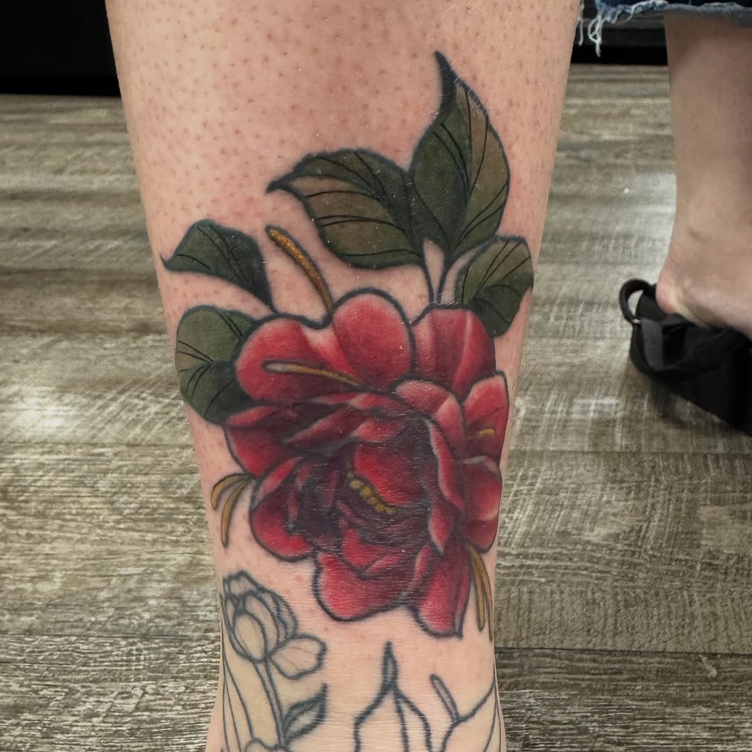 Bold red rose with dark shading and leaves