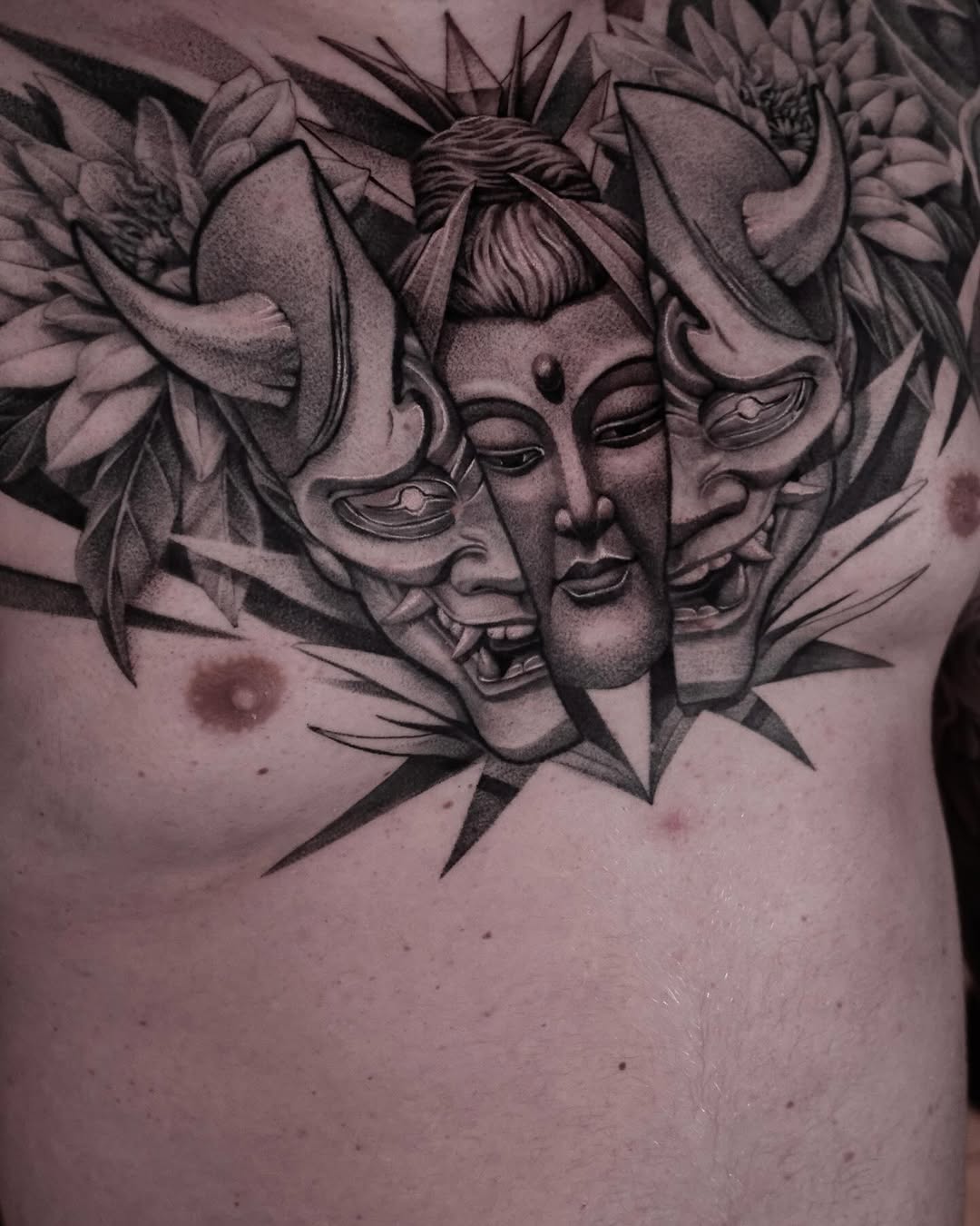 Three-faced Japanese-inspired piece with serene center and demonic masks