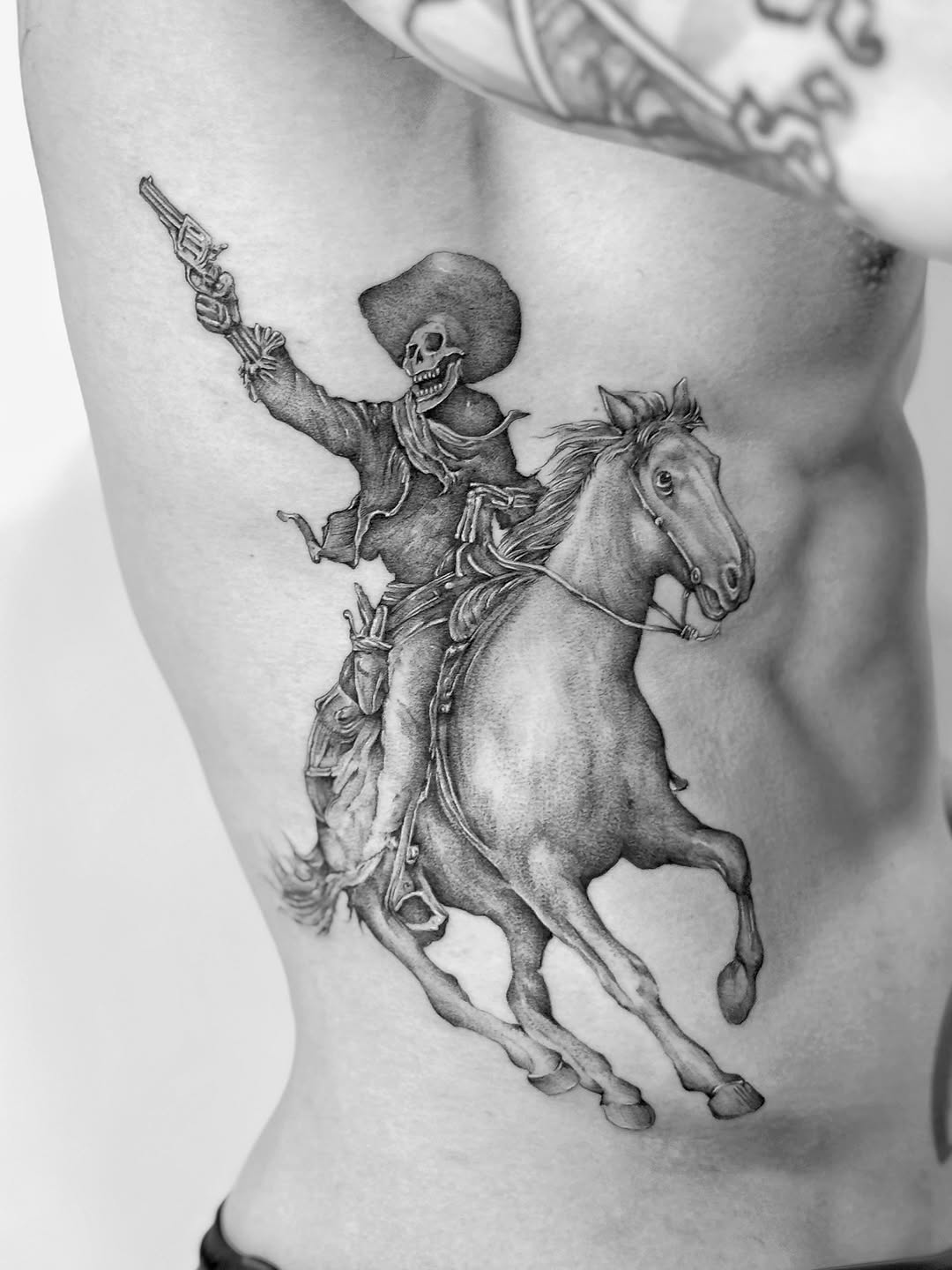 Grim skeletal cowboy on a galloping horse, gun raised.