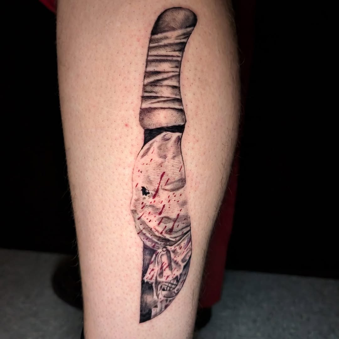 Hyper-detailed black-and-gray knife with blood splatter