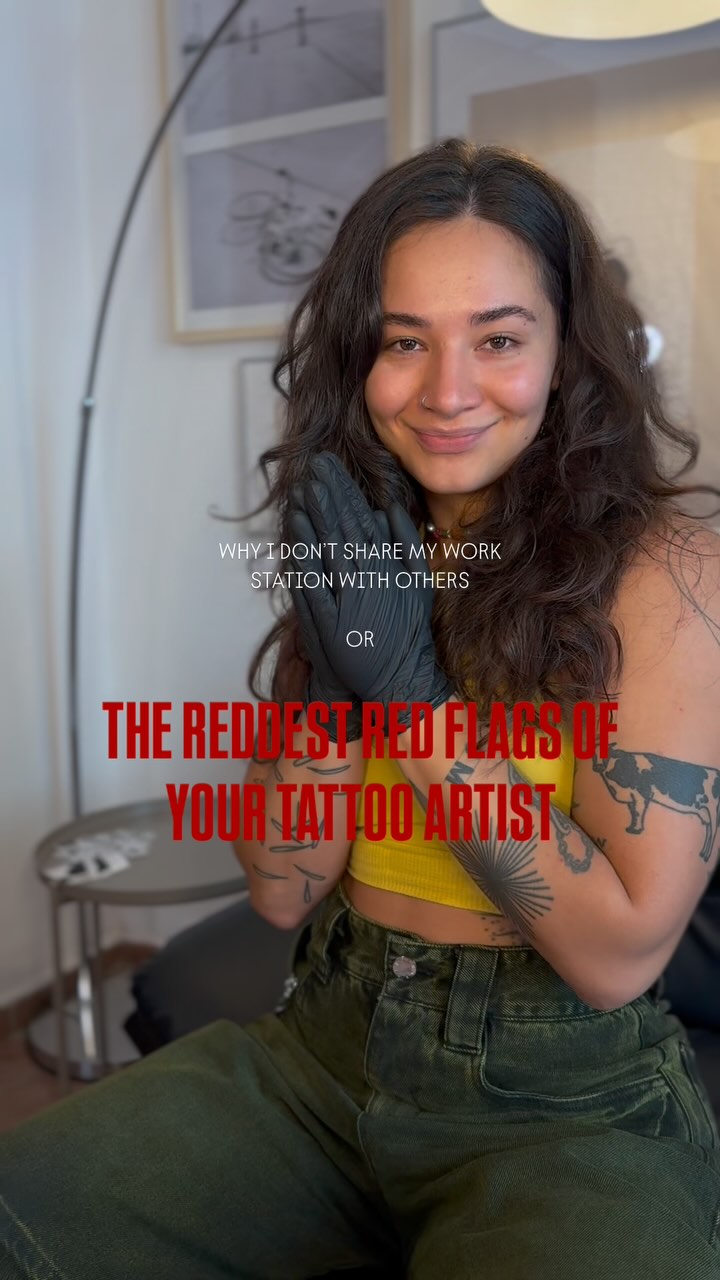 Portrait of tattooed woman with bold blackwork on arms