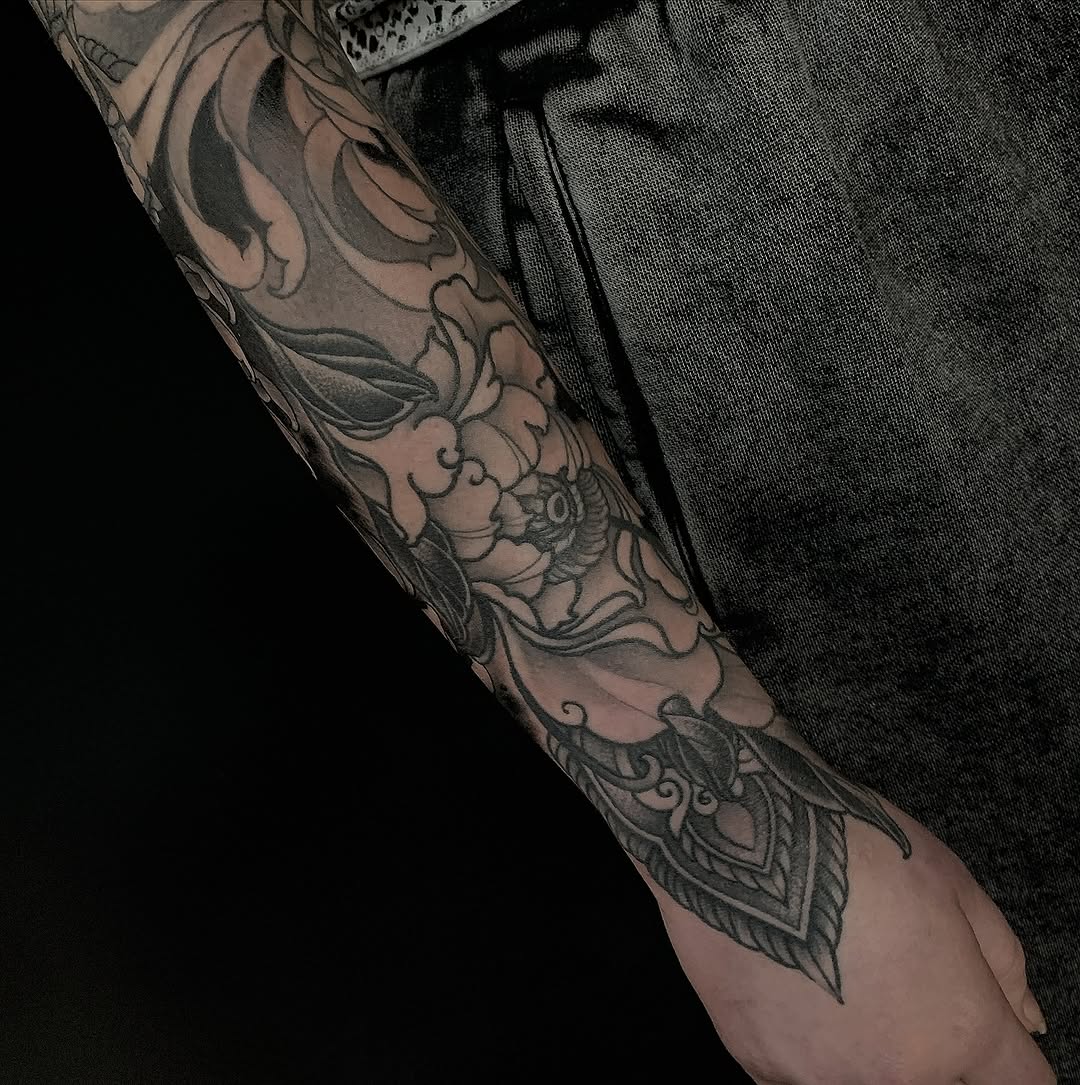 Intricate black-and-gray floral sleeve with ornate linework