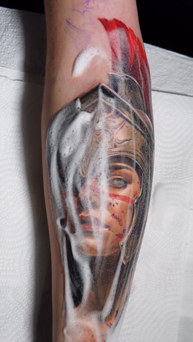 Hyper-realistic Athena portrait with helmet and veil.