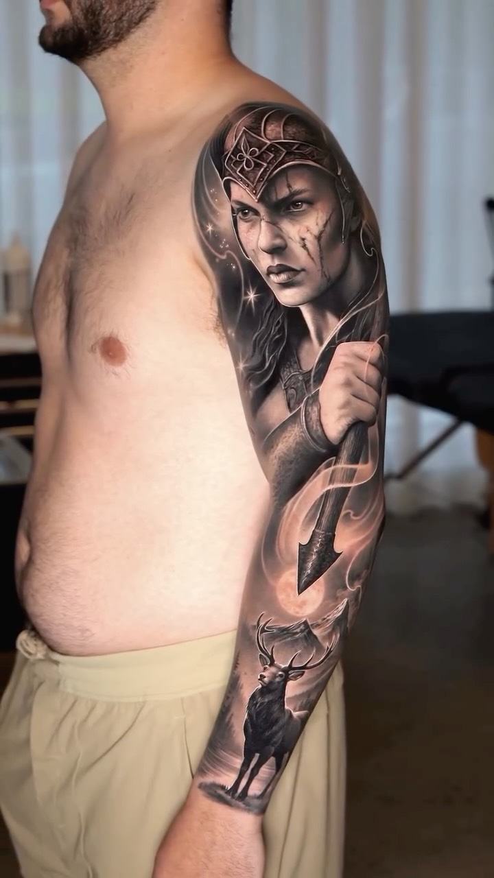 Striking black-and-gray realism sleeve with warrior and stag